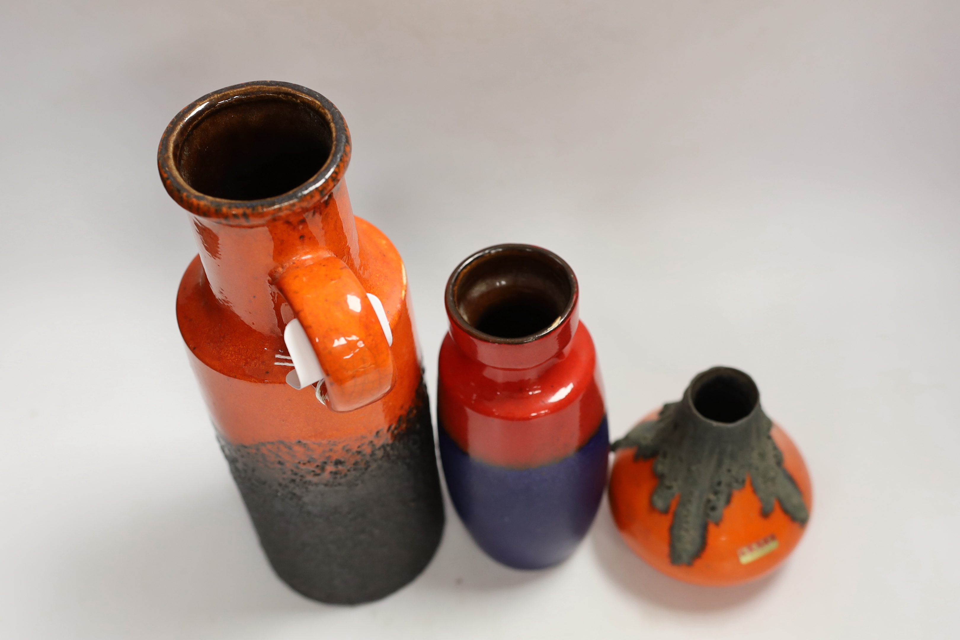 Three West German pottery items including a Scheurich vase and a Roth Keramik volcanic lava glaze, tallest 28cm